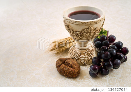 Holy sacrament eucharist symbols with chalice, bread, wheat, grapes 136527054