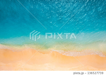 Aerial beach pristine ocean blue waves gold sandy shore tropical coastline Aerial beach pristine ocean blue waves gold sandy shore tropical coastline 136527739