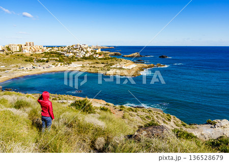 Tourist woman on sea coast in Spain 136528679