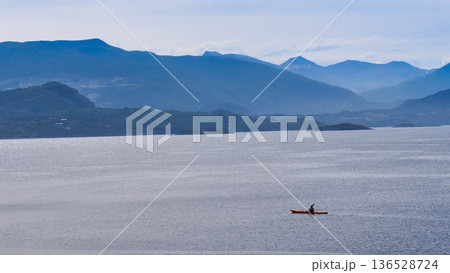 People kayaking on sea fjord 136528724