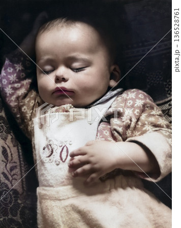 A vintage portrait of a peacefully sleeping baby. Retro photo from 1968. 136528761