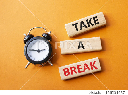 Take a break symbol. Concept words Take a break on wooden blocks. Beautiful orange background with alarm clock. Business and Take a break concept. Copy space. 136535687
