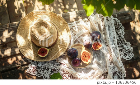 Fig with Straw Hat on Rustic Wooden Table 136536456