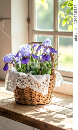 Picnic Basket with Irises on Wooden Counter in Rustic Cottage Kitchen Picnic Basket with Irises on Wooden Counter in Rustic Cottage Kitchen 136536582