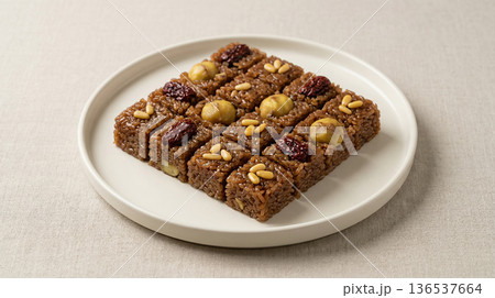 Traditional Korean Yakbap Sweet Rice Cake with Chestnuts and Jujube on White Plate 136537664