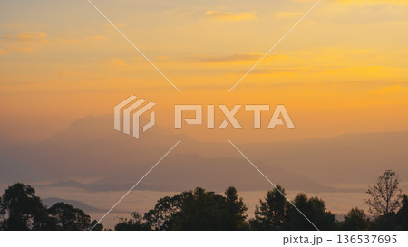 sunrise with moving of cloud and clear sky and layer of mountain sunrise with moving of cloud and clear sky and layer of mountain 136537695