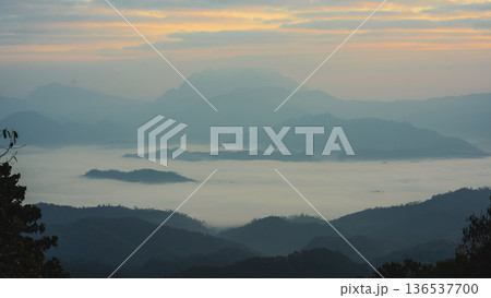 sunrise with moving of cloud and clear sky and layer of mountain 136537700