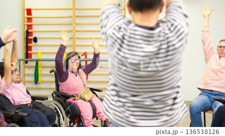 People with physical disabilities exercising together promoting inclusion and diversity People with physical disabilities exercising together promoting inclusion and diversity 136538126