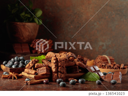 Brownie with blueberries and mint. 136541023