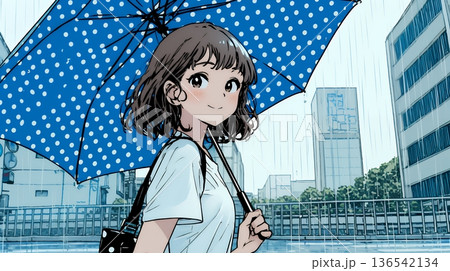 雨の日に傘をさして歩く若い女性
