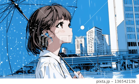 雨の日に傘をさして歩く若い女性