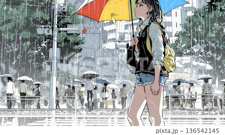 雨の日に傘をさして歩く若い女性