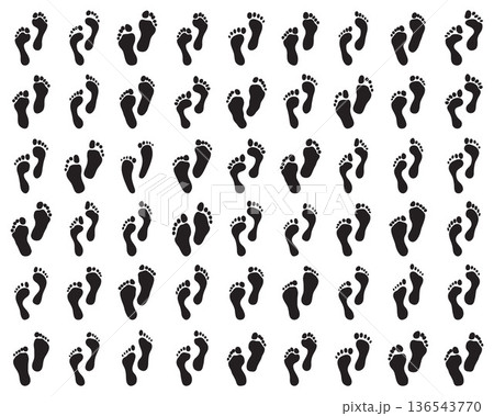 Black prints of human feet on a white background 136543770