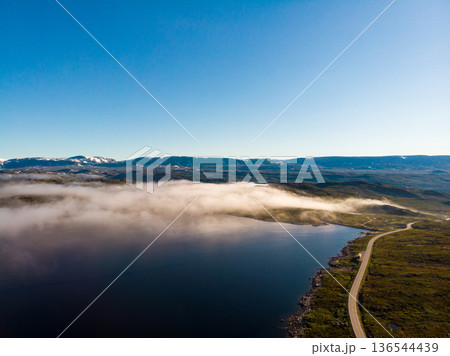 Road crossing Hardangervidda plateau, Norway. Aerial view. Road crossing Hardangervidda plateau, Norway. Aerial view. 136544439