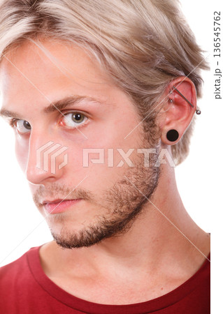 Teen boy with piercing and fashionable hairstyle 136545762