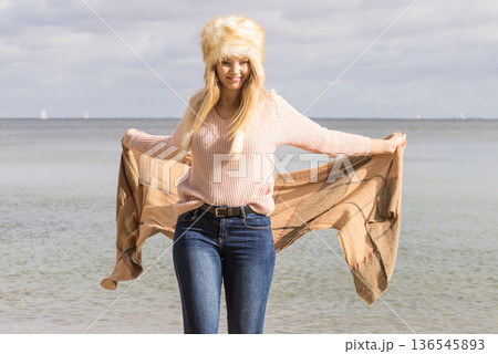 Fashionable woman on beach Fashionable woman on beach 136545893
