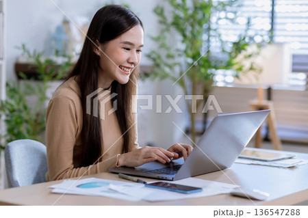 Business woman at desk in office for celebration of goals or target. 136547288