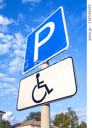 Road sign Parking place for the disabled against the blue sky Road sign Parking place for the disabled against the blue sky 136548265