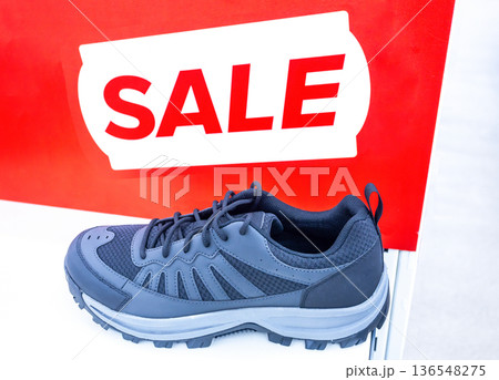 New stylish sneakers. Sporting footwear. Sale of modern sneakers 136548275
