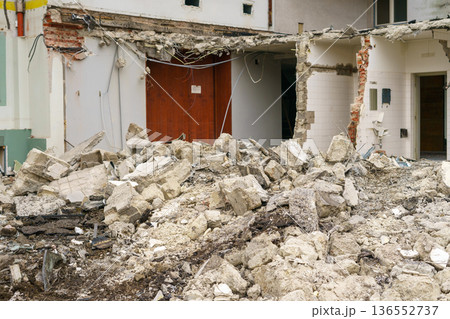 Construction site inside a building with broken walls, debris and exposed structure, renovation process, urban redevelopment, reconstruction concept 136552737
