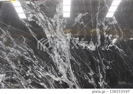 Dramatic pattern of Copacabana marble in vertical format showing strong contrast between deep black minerals and crystalline white veins. Dramatic pattern of Copacabana marble in vertical format showing strong contrast between deep black minerals and crystalline white veins. 136553597