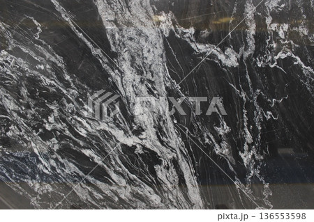 Copacabana natural stone surface with dynamic black-and-white motif flow, ideal for accent walls or floors in luxury rooms. Copacabana natural stone surface with dynamic black-and-white motif flow, ideal for accent walls or floors in luxury rooms. 136553598