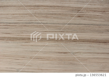 Detail of beige Serpeggiante wooden marble texture featuring dense and consistent natural line patterns. 136553621
