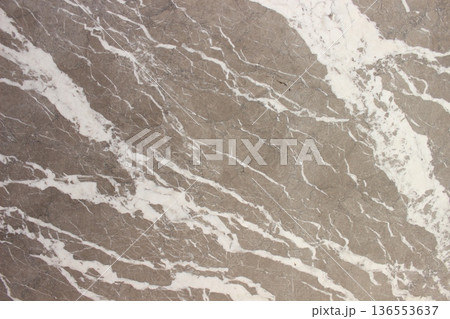 Close up of Grigio Billiemi marble texture showing details of natural white calcite cracks on a gray base. Close up of Grigio Billiemi marble texture showing details of natural white calcite cracks on a gray base. 136553637