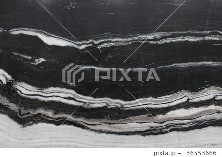 Black Forest marble texture with wavy black and white horizontal stripe patterns resembling natural wood grain. Black Forest marble texture with wavy black and white horizontal stripe patterns resembling natural wood grain. 136553666