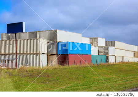 Containers stacked in shipping yard during day shipping cargo containers top down Containers stacked in shipping yard during day shipping cargo containers top down 136553786