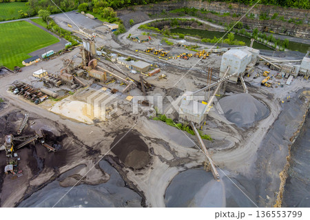 Construction site in quarry with large machinery piles of materials observed 136553799
