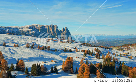 Panorama of the Dolomites mountains during autumn sunrise. Beautiful panorama of Alpe di Siusi , Italy Panorama of the Dolomites mountains during autumn sunrise. Beautiful panorama of Alpe di Siusi , Italy 136556283