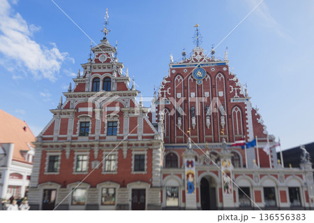 Riga Old Town view, Latvia, streets of Vecriga historical center with Town Hall square, House Of The Black Heads, Cathedral and church, travel to Latvia and Baltic States, summer day with a blue sky Riga Old Town view, Latvia, streets of Vecriga historical center with Town Hall square, House Of The Black Heads, Cathedral and church, travel to Latvia and Baltic States, summer day with a blue sky 136556383