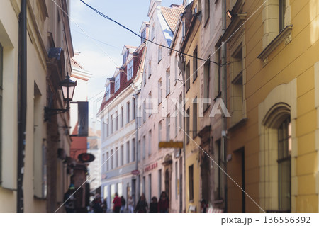 Riga Old Town view, Latvia, streets of Vecriga historical center with Town Hall square, House Of The Black Heads, Cathedral and church, travel to Latvia and Baltic States, summer day with a blue sky Riga Old Town view, Latvia, streets of Vecriga historical center with Town Hall square, House Of The Black Heads, Cathedral and church, travel to Latvia and Baltic States, summer day with a blue sky 136556392