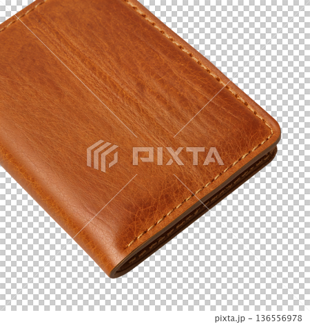 Leather Wallet Lying on a Table in a Bright Room During the Day 136556978