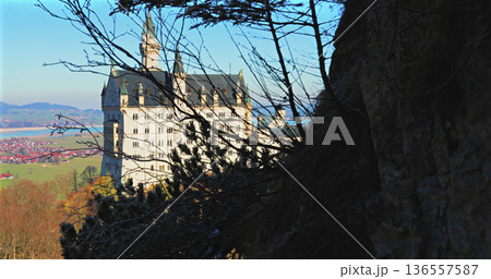 Castle stands on a hill with trees around it in Germany during a clear sunny day in autumn Castle stands on a hill with trees around it in Germany during a clear sunny day in autumn 136557587
