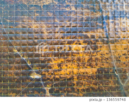 Budapest Industrial Texture of Old Reinforced Wire Glass with Internal Mesh Grid and Rusty Amber Stains and a Diagonal Crack at Pongratz Gergely ter Architectural Detail Background Pattern Art 136559748