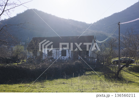 Skadar Lake National park panoramic landscape, Montenegro, Hiking in Skadar Lake, Skadarsko jezero, also called Shkodra or Scutari, with mountains and village in a sunny day, Montenegrin Balkan nature 136560211