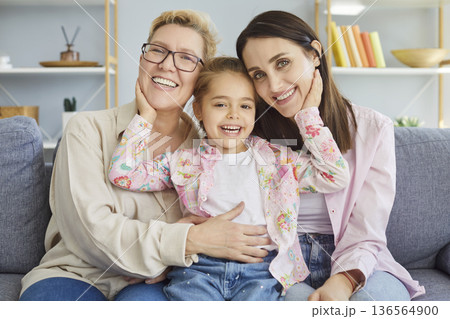 Mother and daughter, granddaughter three generations family portrait together, happy mothers day Mother and daughter, granddaughter three generations family portrait together, happy mothers day 136564900