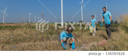 Family collecting garbage at park 136565826