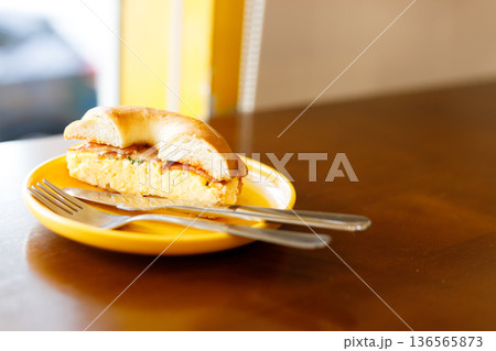 Bagel bread with scrambled egg and bacon. Bagel bread with scrambled egg and bacon. 136565873