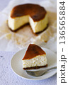 Cheesecake with baking paper on white marble table. 136565884
