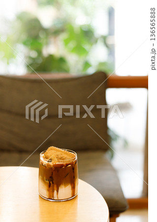 Iced latte coffee on top with biscuit. 136565888