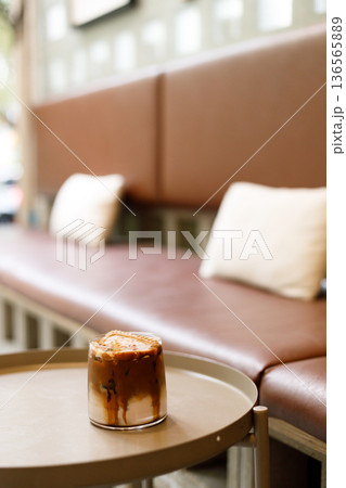 Iced latte coffee on top with biscuit. Iced latte coffee on top with biscuit. 136565889