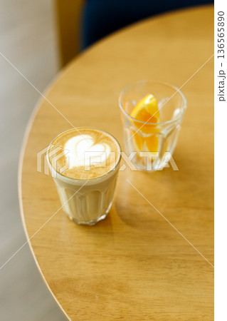 Cup of coffee latte art on wood table. 136565890
