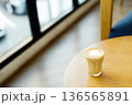 Cup of coffee latte art on wood table. 136565891