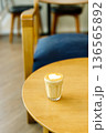 Cup of coffee latte art on wood table. 136565892