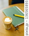 Cup of coffee latte art on wood table. 136565893