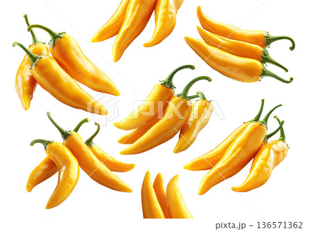 Fresh yellow chili peppers in various bunches, isolated on clean white background, concept of spicy food 136571362