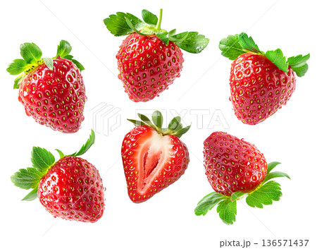 Juicy whole and halved strawberries with green leaves scattered and isolated on white background, freshness and healthy eating Juicy whole and halved strawberries with green leaves scattered and isolated on white background, freshness and healthy eating 136571437